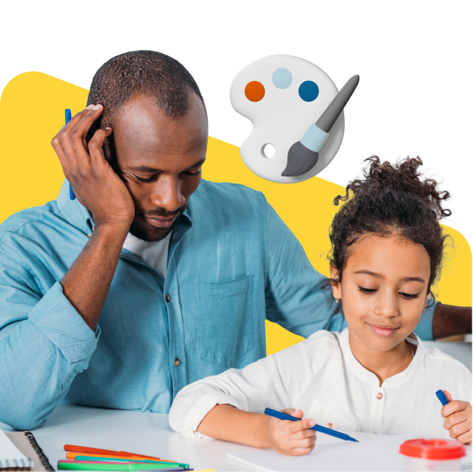 A girl coloring next to her father